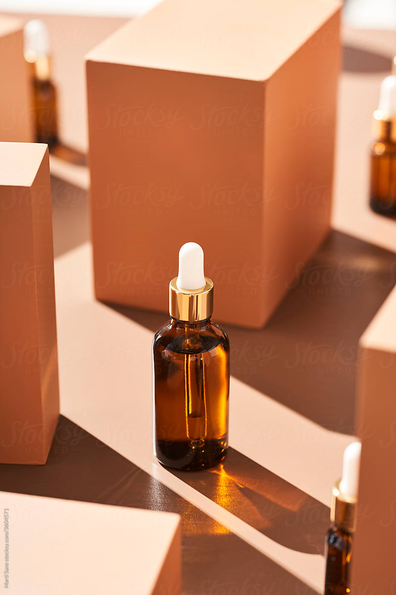 Bottle of essential oil near boxes