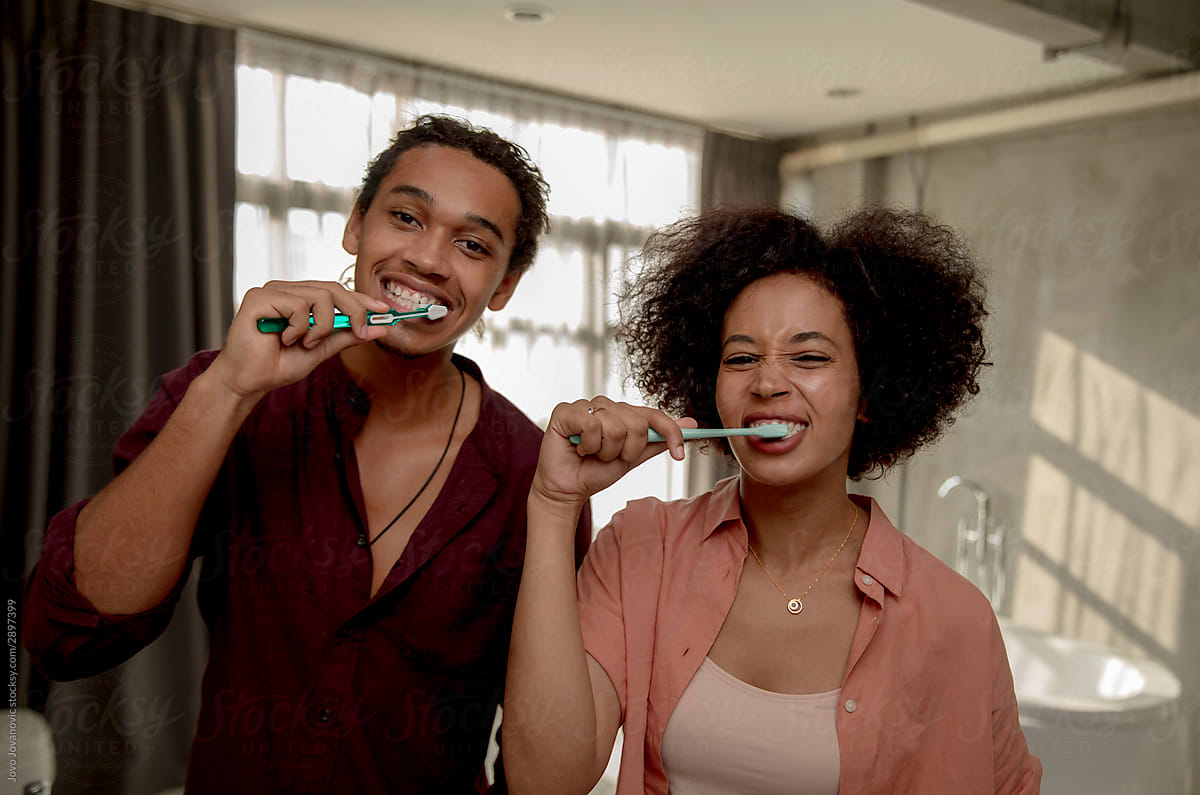 Couple Brushing Teeth Together By Jovo Jovanovic