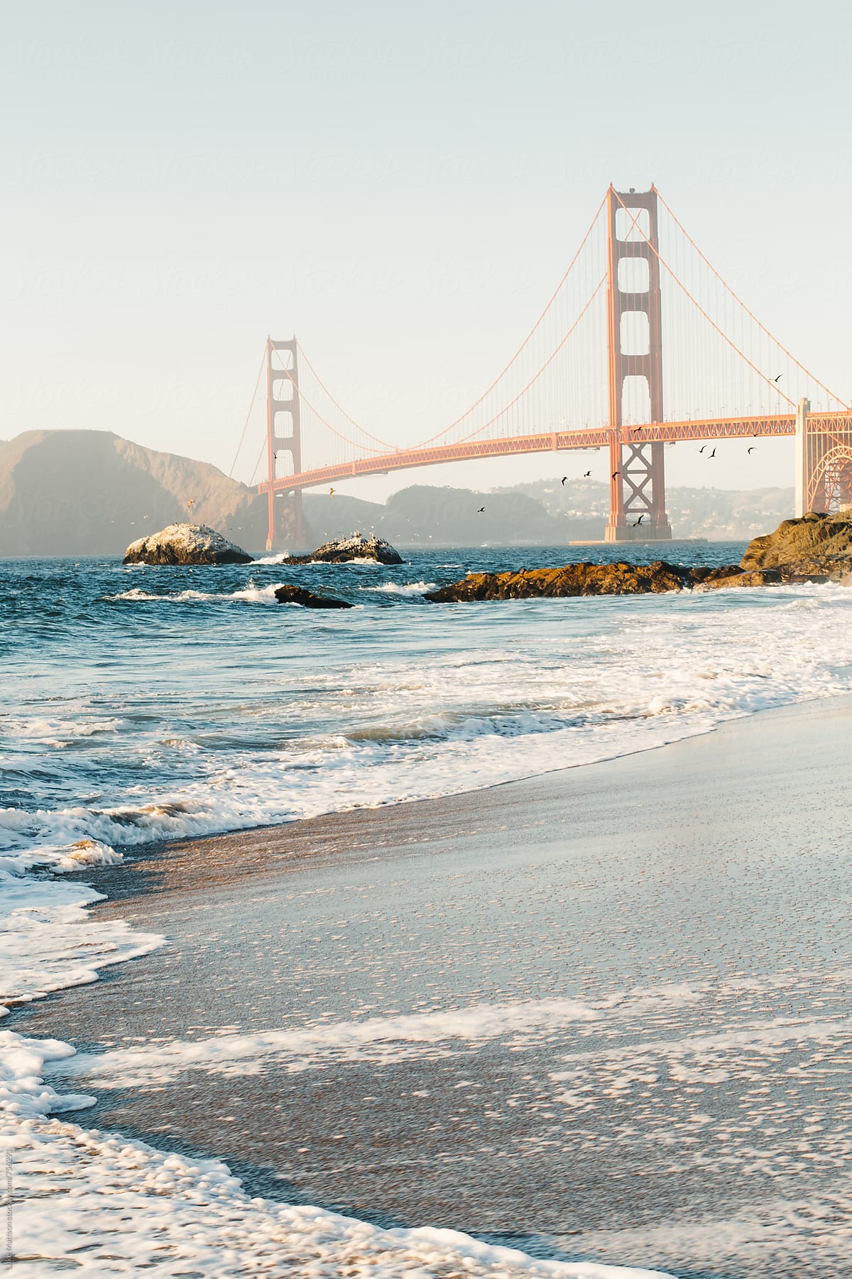 View Of Golden Gate Bridge From Shore Of Baker Beach