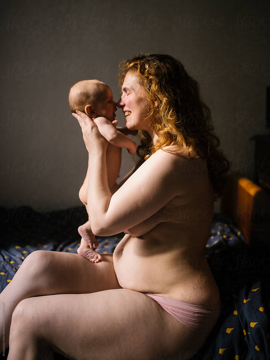Naked Mom And Her Nude Newborn Son Sitting In Bed by Stocksy Contributor  Anastasia Khandozhenko - Stocksy