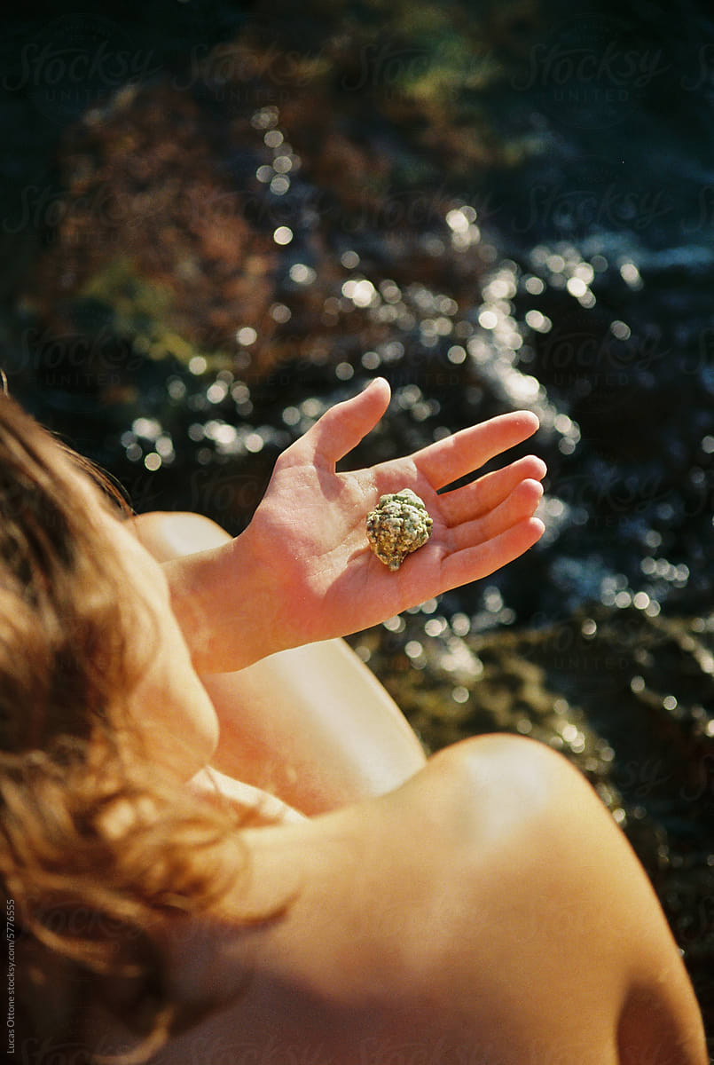 Woman holding a seashell