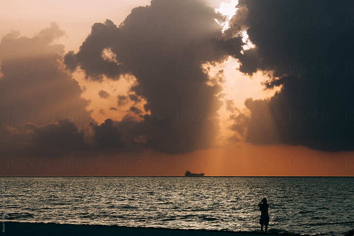 Onlooker watching sunrise in Playa del Carmen