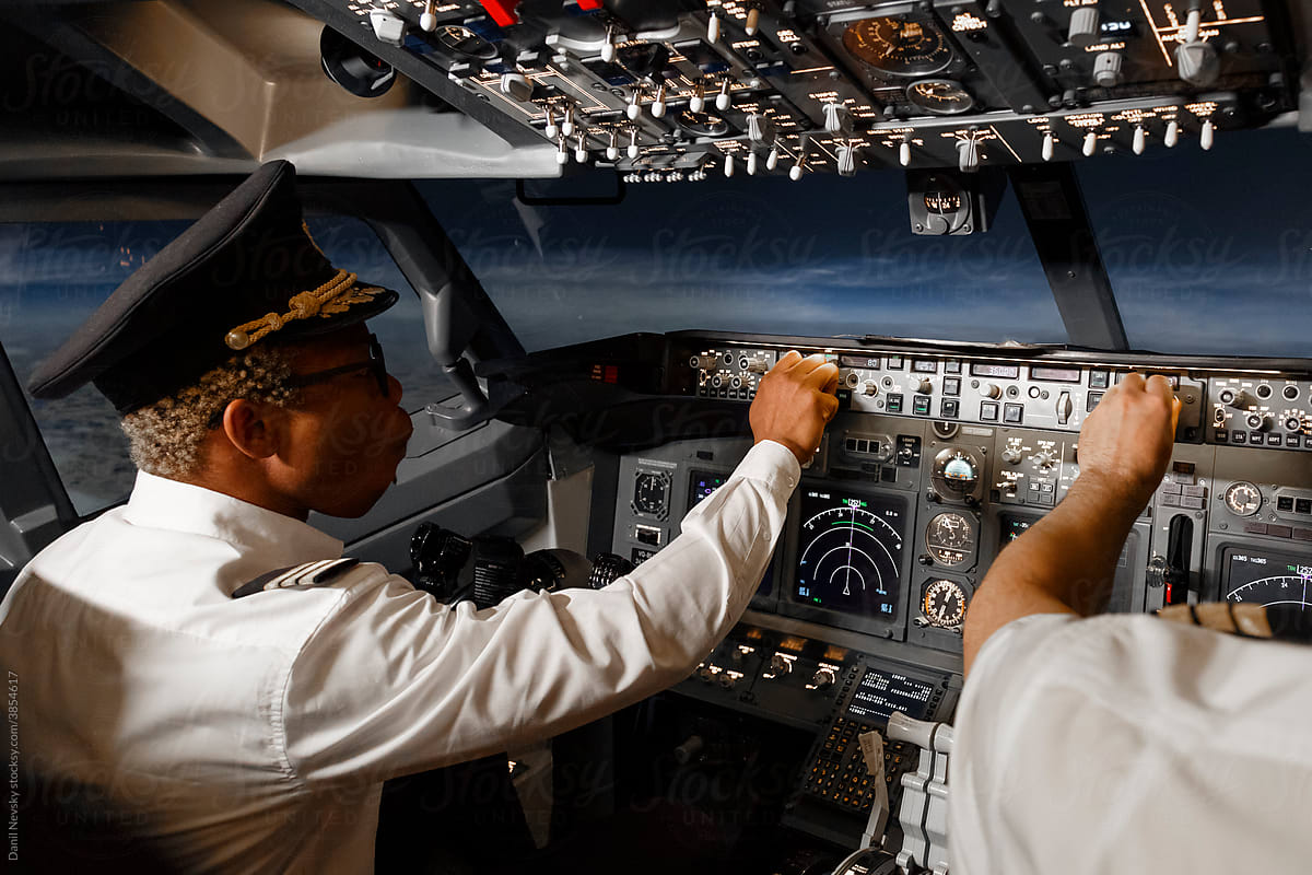 Diverse pilots controlling plane during flight