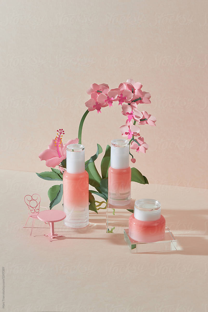 Pink natural cosmetic with flowers made from paper.