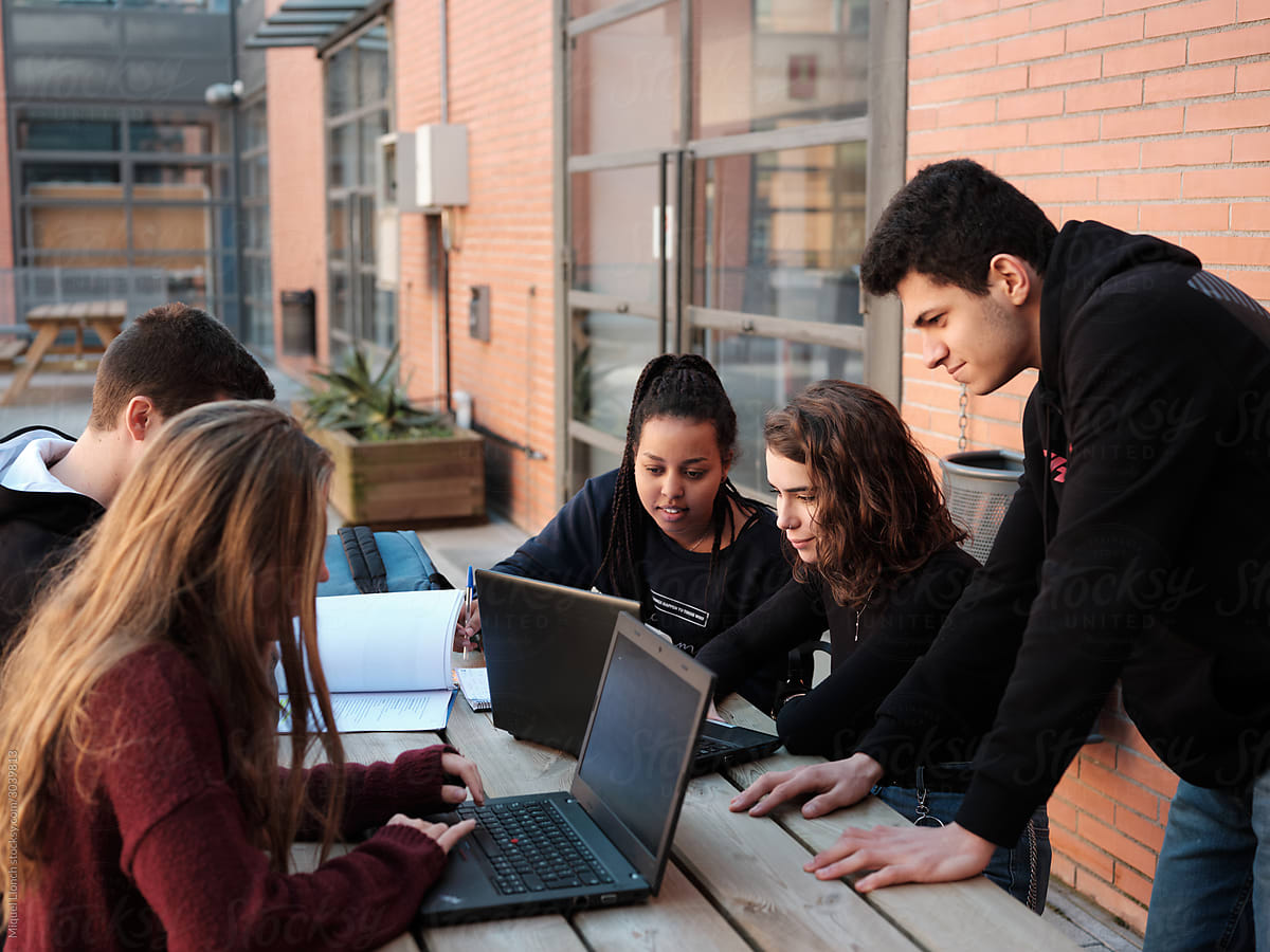 Group of students working with computers in campus