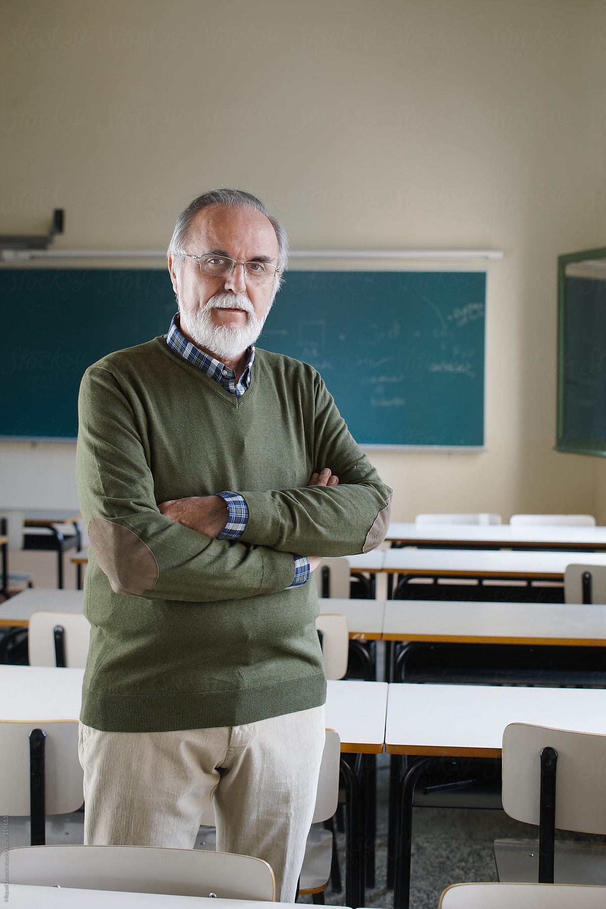 Portrait of a senior professor in a classroom