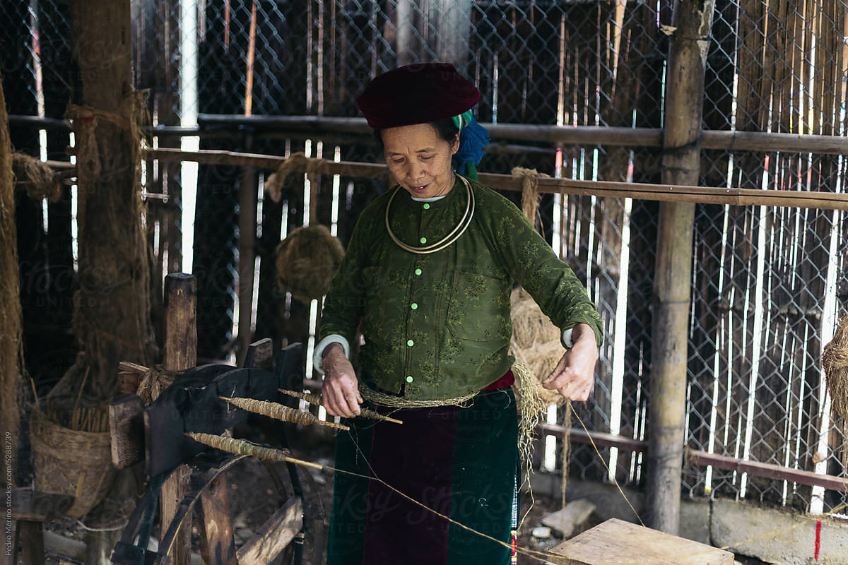 Hmong woman weaving in a workshop in the countryside in Vietnam