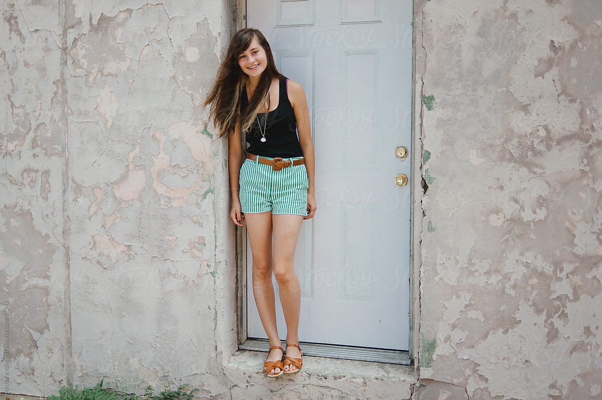 Girl Standing In Doorway With Wind By Stocksy Contributor Michelle Edmonds Stocksy 3682