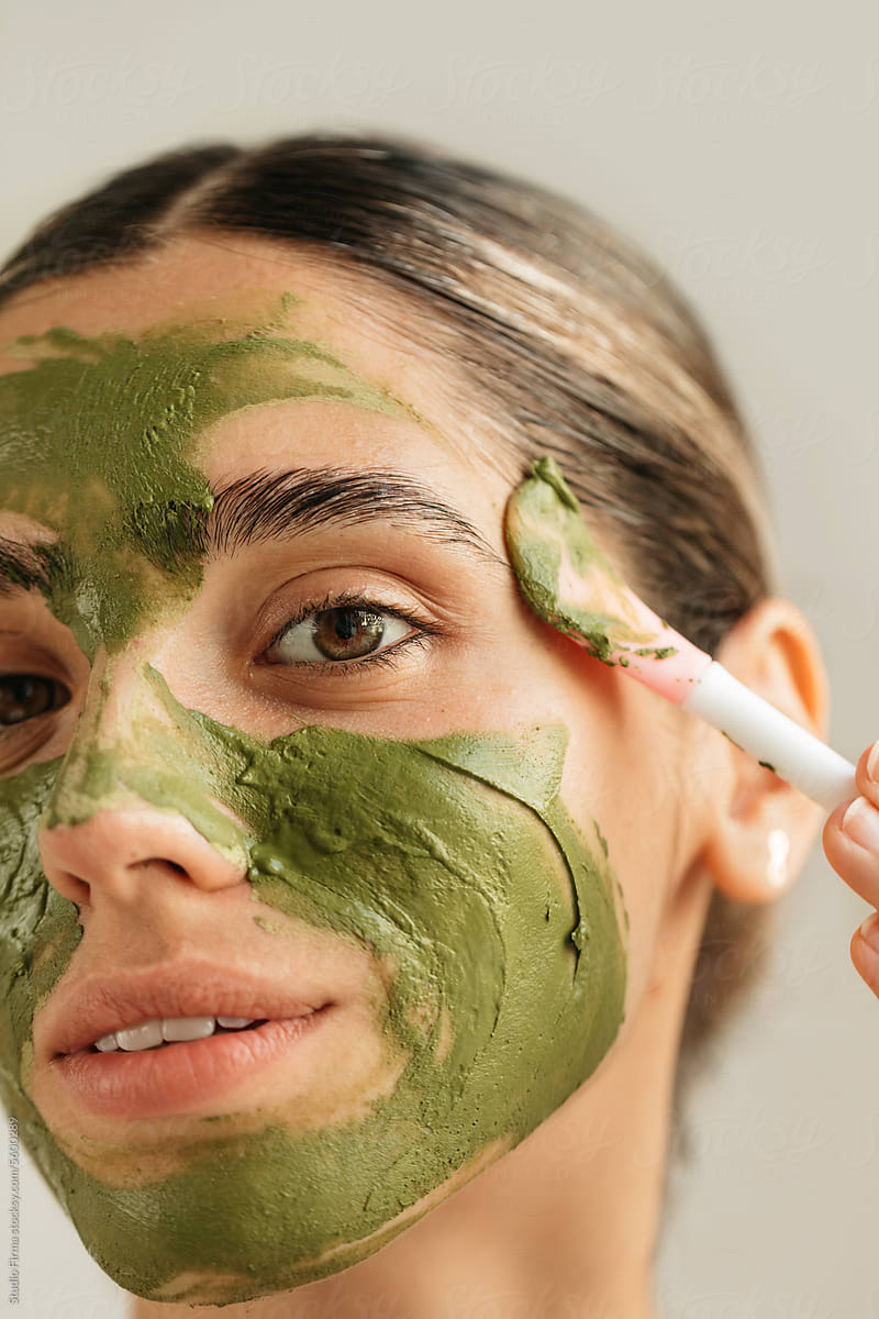 Woman with Green Facial Mask