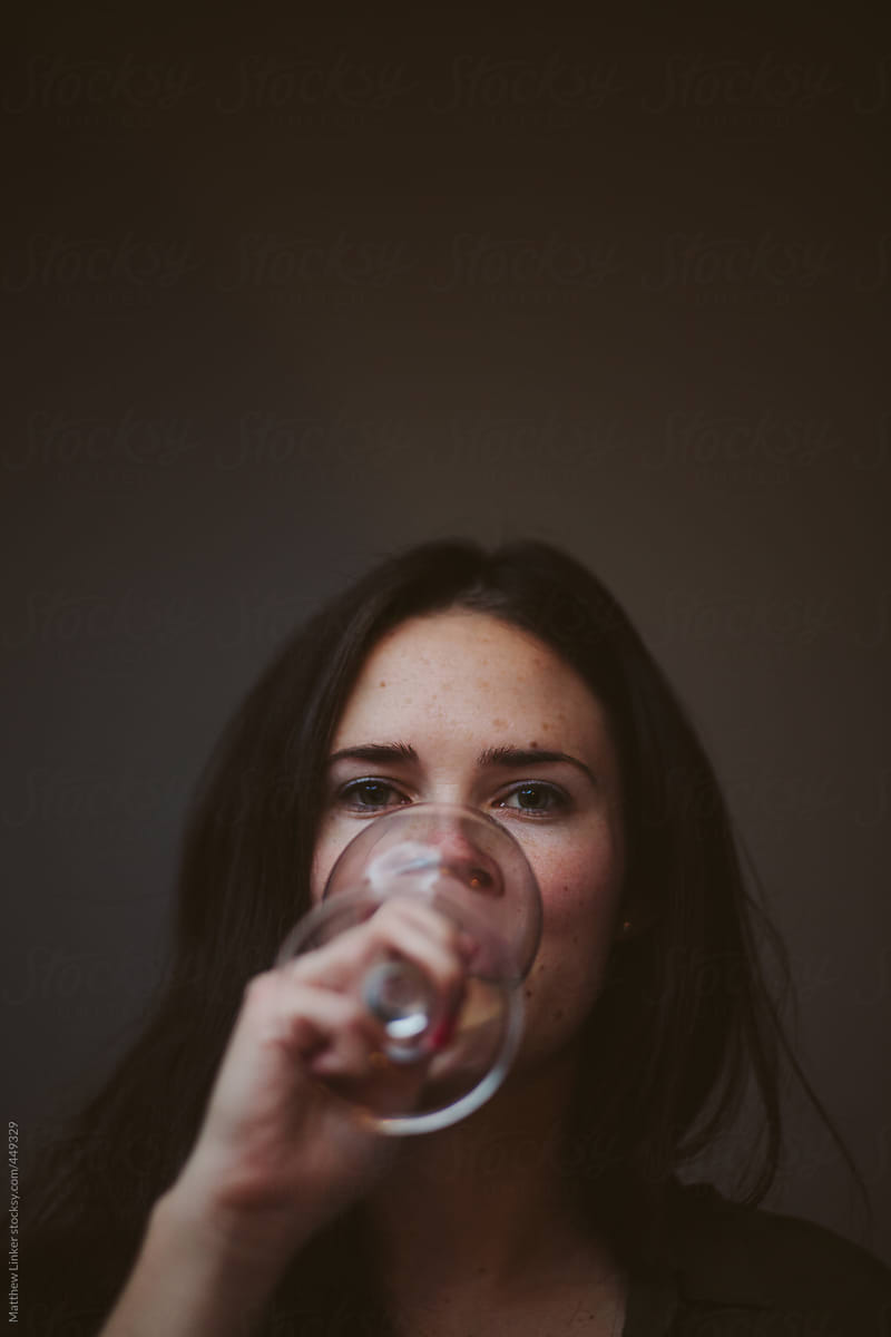 Young woman enjoying a glass of wine