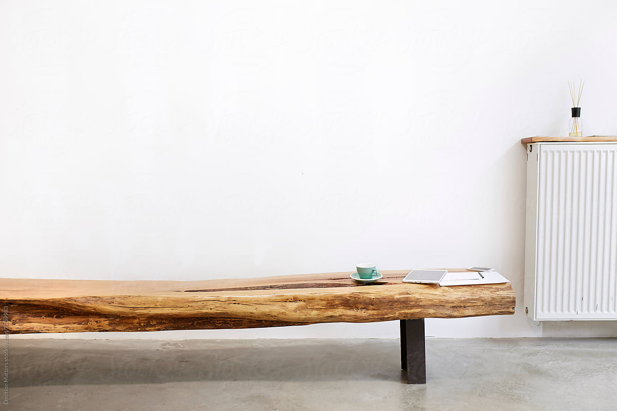Studio product display of a long wooden bench