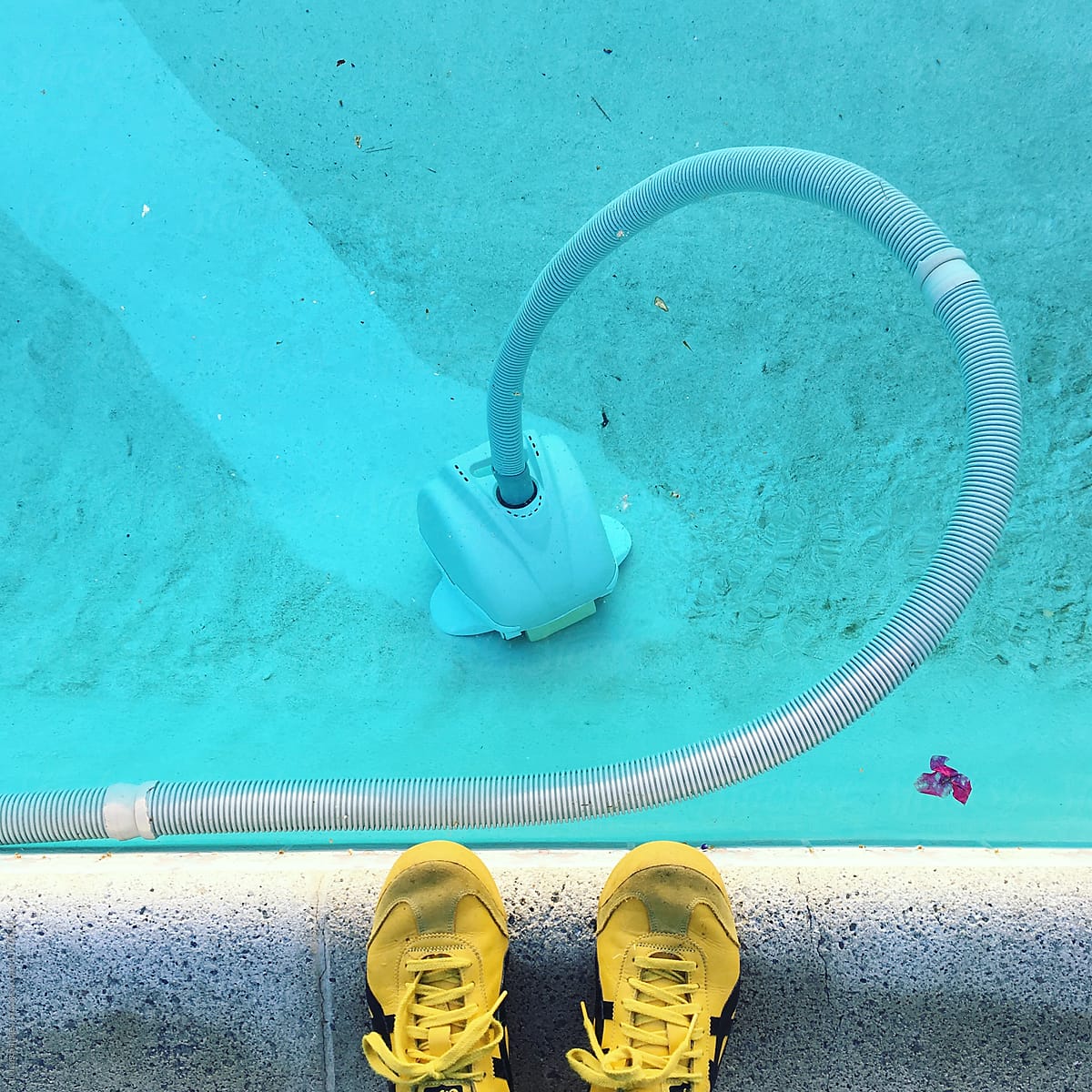 Working vacuum cleaner in swimming pool.