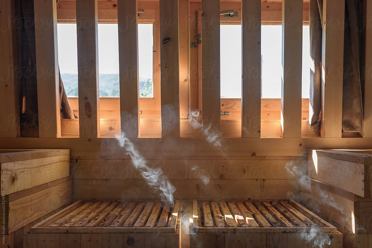 Smoke over beehives in wooden house