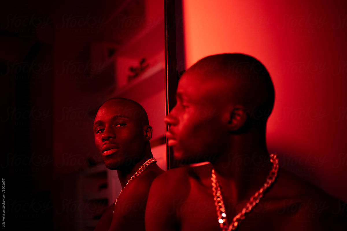 Portrait Of A Black Man Reflected On A Mirror.