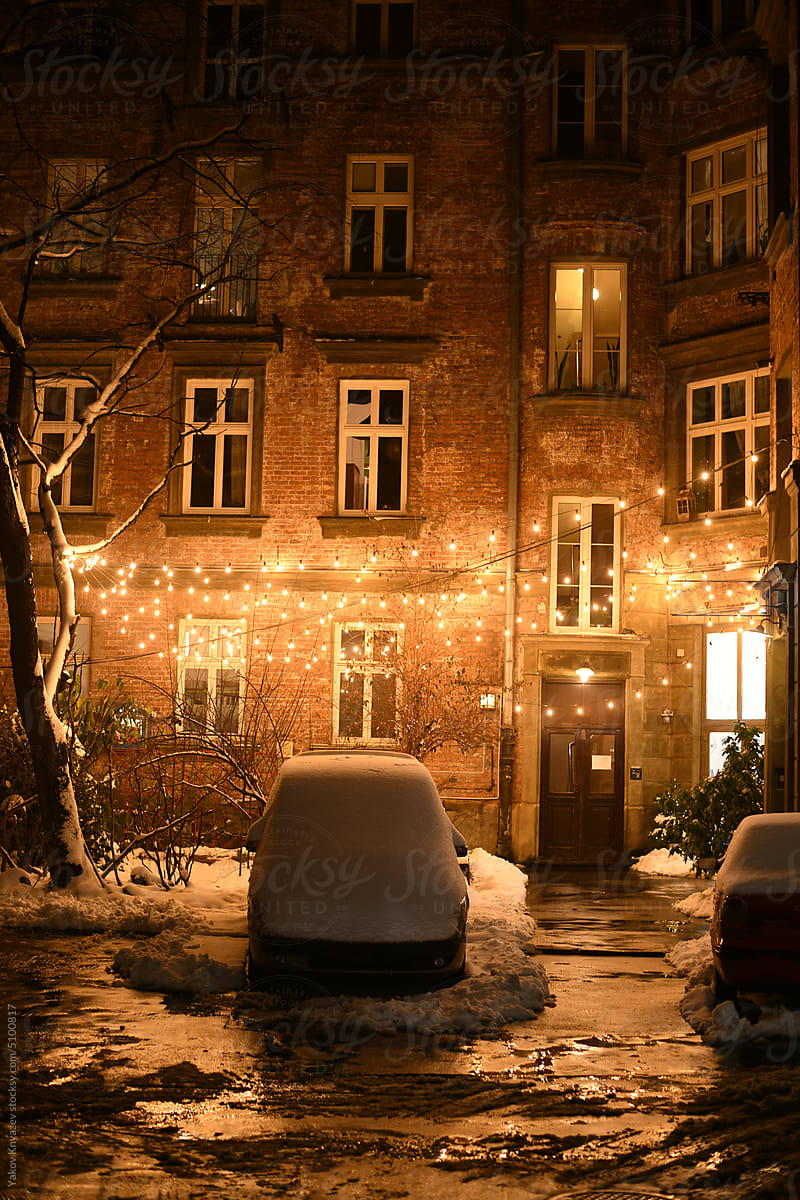 winter in Europe - cozy backyard with glowing garland