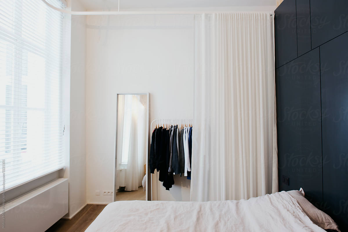 interior shot from a modern white loft with black cupboard