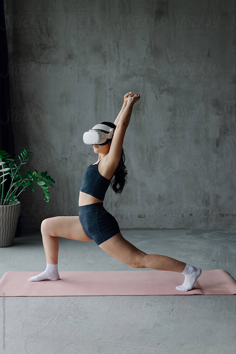A woman engaged in virtual fitness