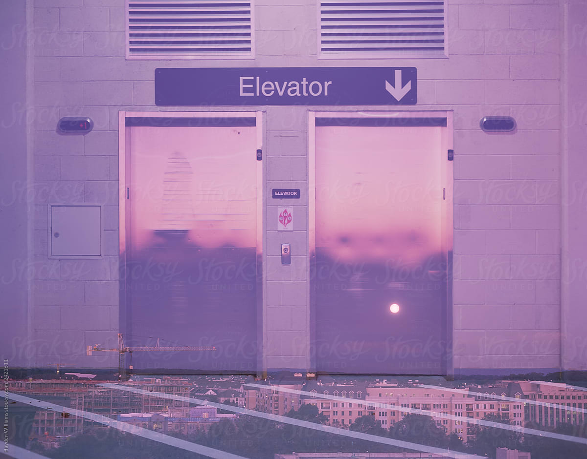 Elevator Doors Reflecting Pink Sunset Light