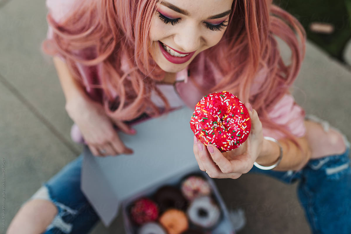 Girl about to eat a donut