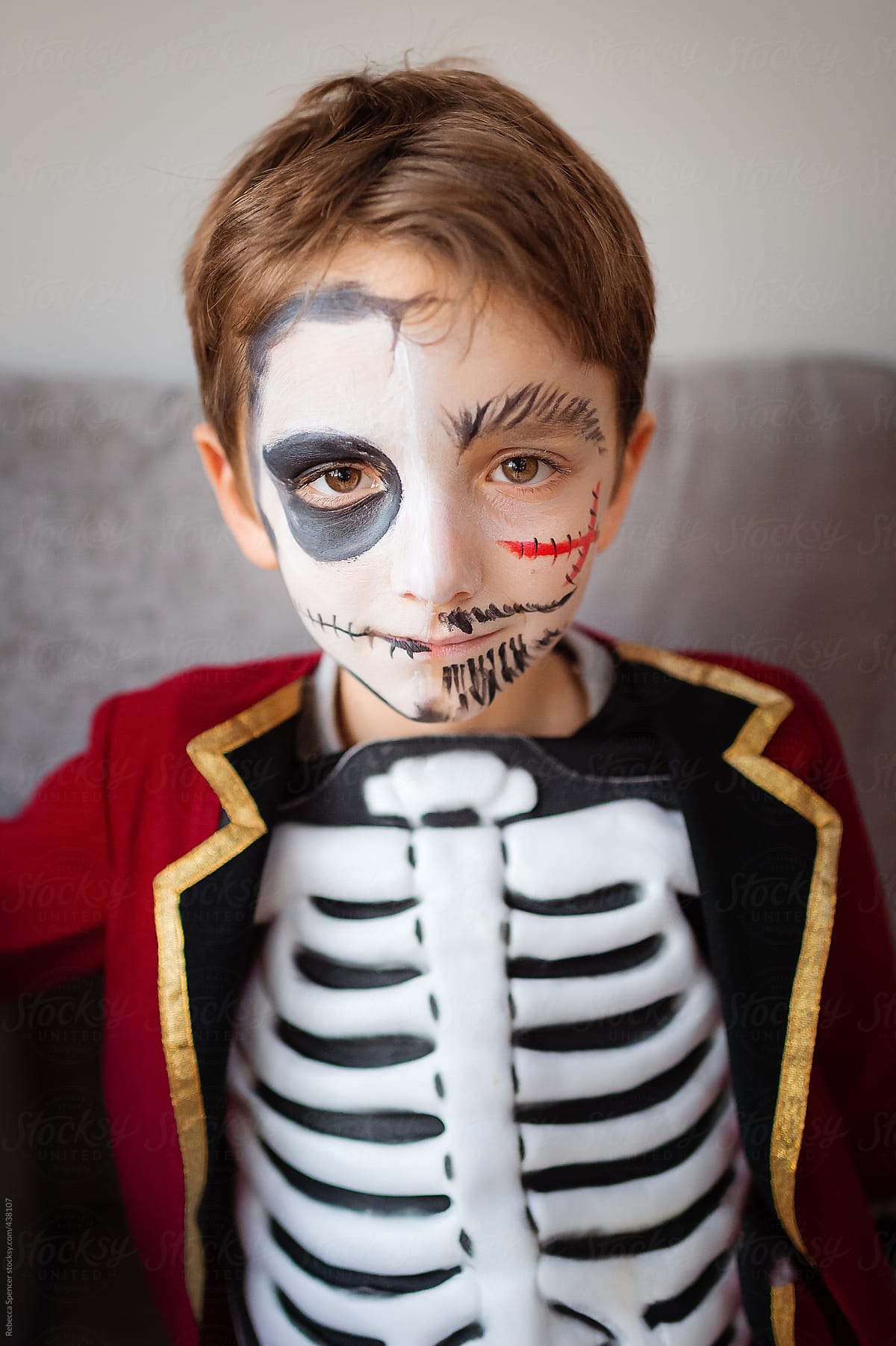 Close up of boy dressed as skeleton pirate for Halloween