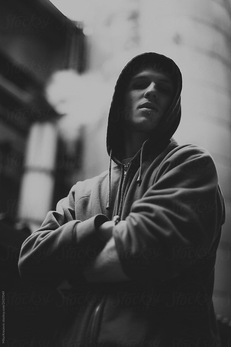 Black and white portrait of a Man in a hooded sweatshirt