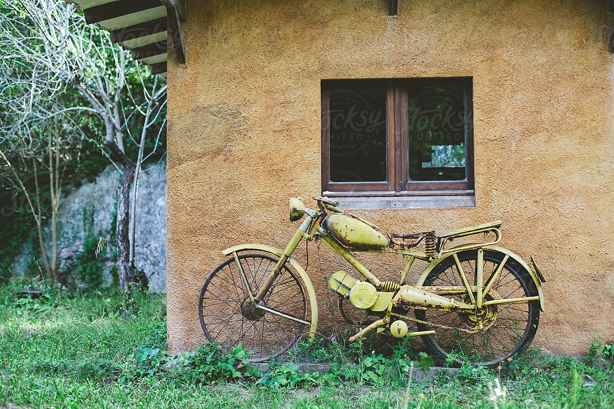 Old yellow motor bike.
