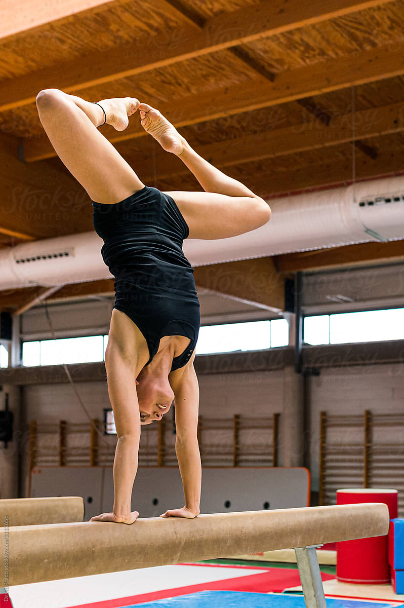 young artistic gymnast woman performing and training