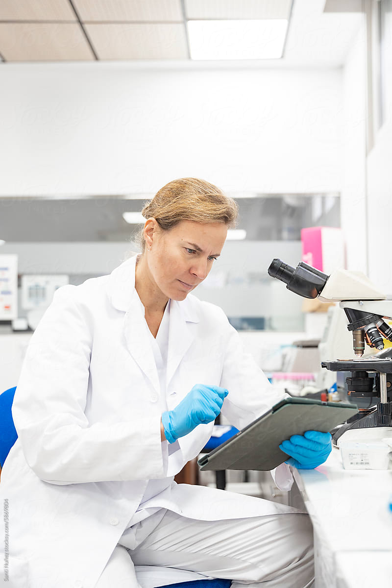 scientist looking at report in a laboratory