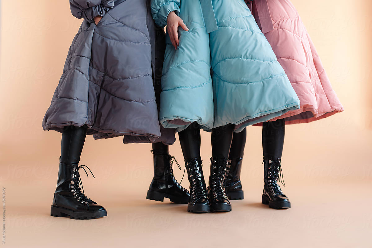 Unrecognizable women group fashion studio winter coats