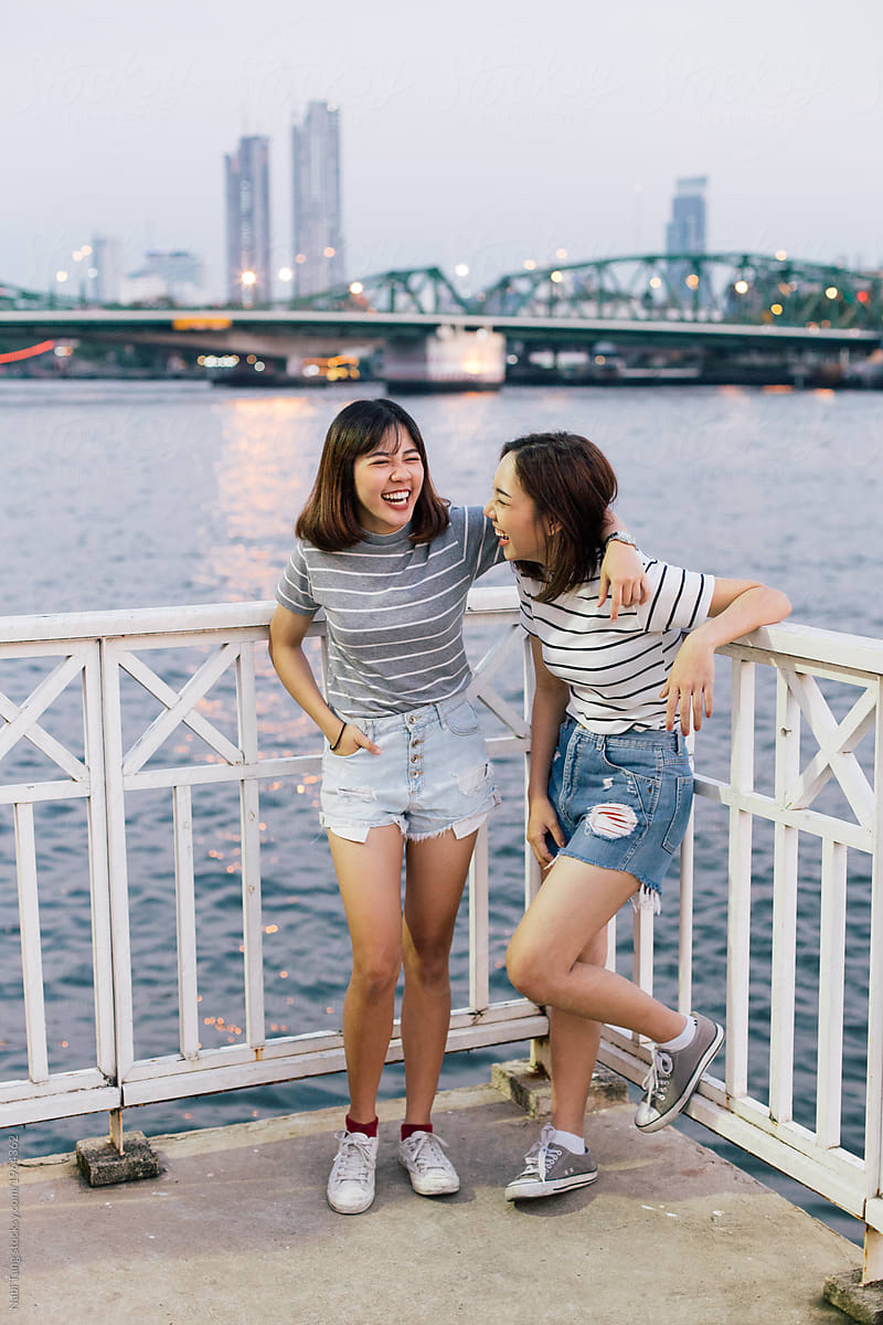 2 Asian Girls Portrait By The River Side In Bangkok By Stocksy