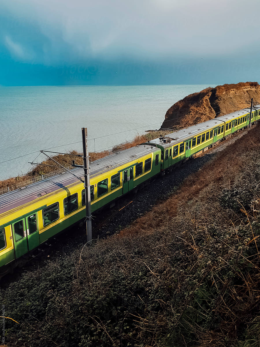 Train Travelling on a Scenic Landscape of Ireland . Stock Picture