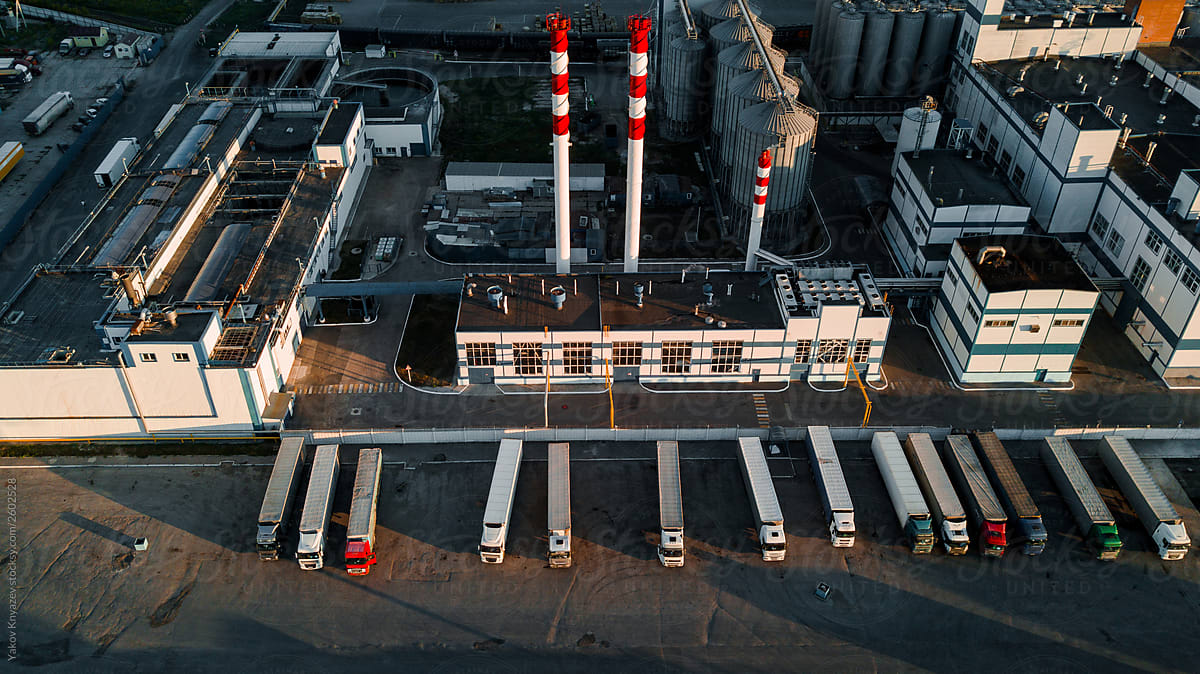 drone shot of a beer factory - tall pipes and tanks