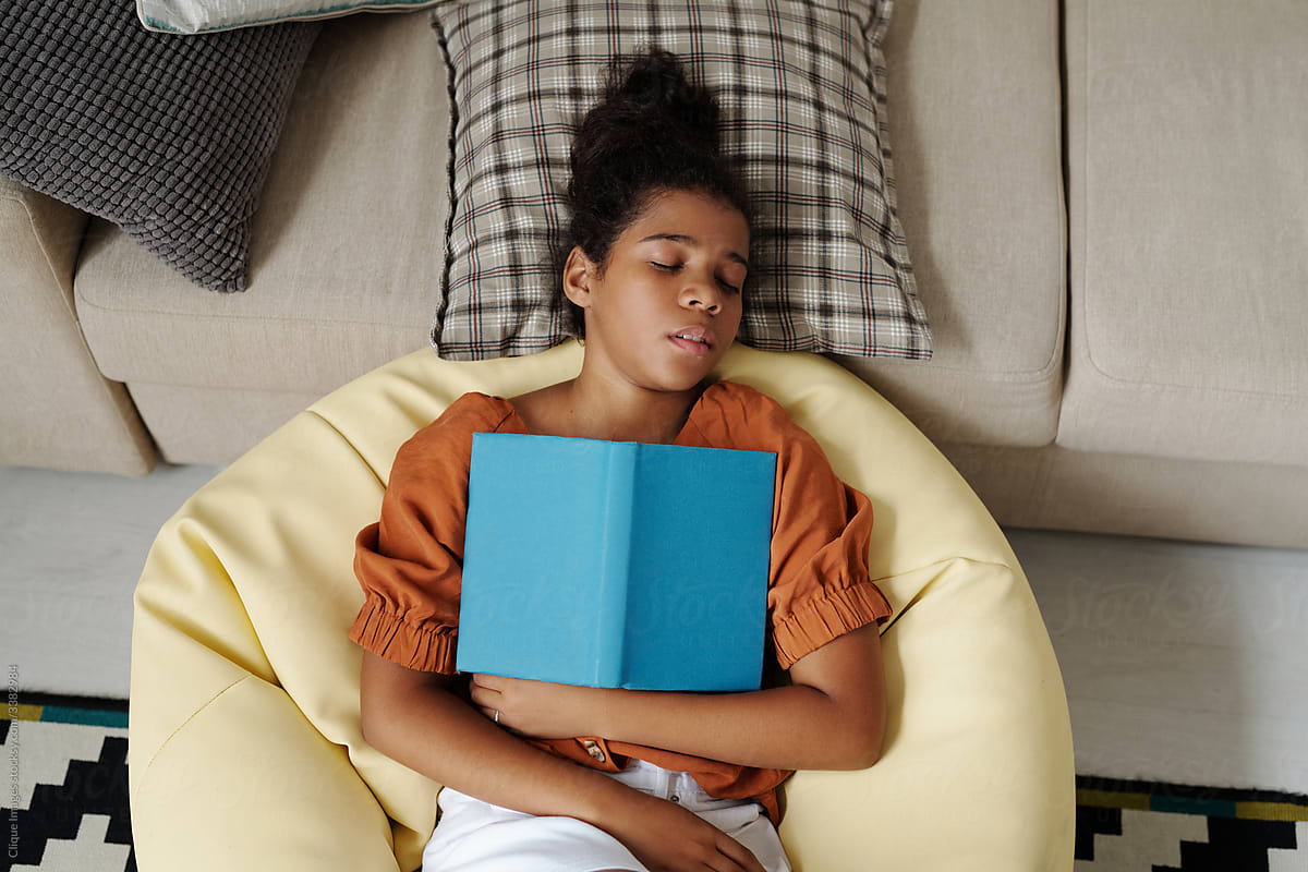 Teen Girl Sleeping With Book
