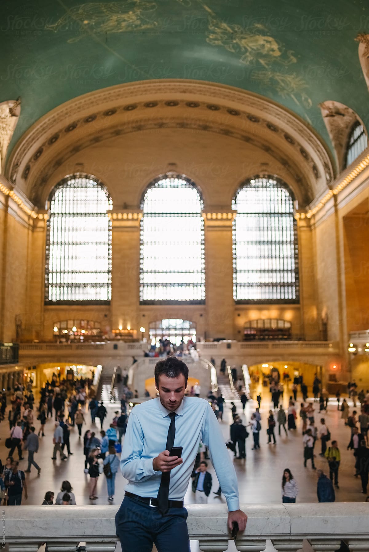 Businessman using a phone in Grand Central Station - New York