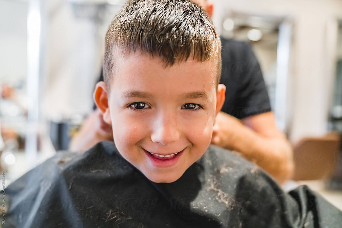 Chherful boy in hairdressing salon