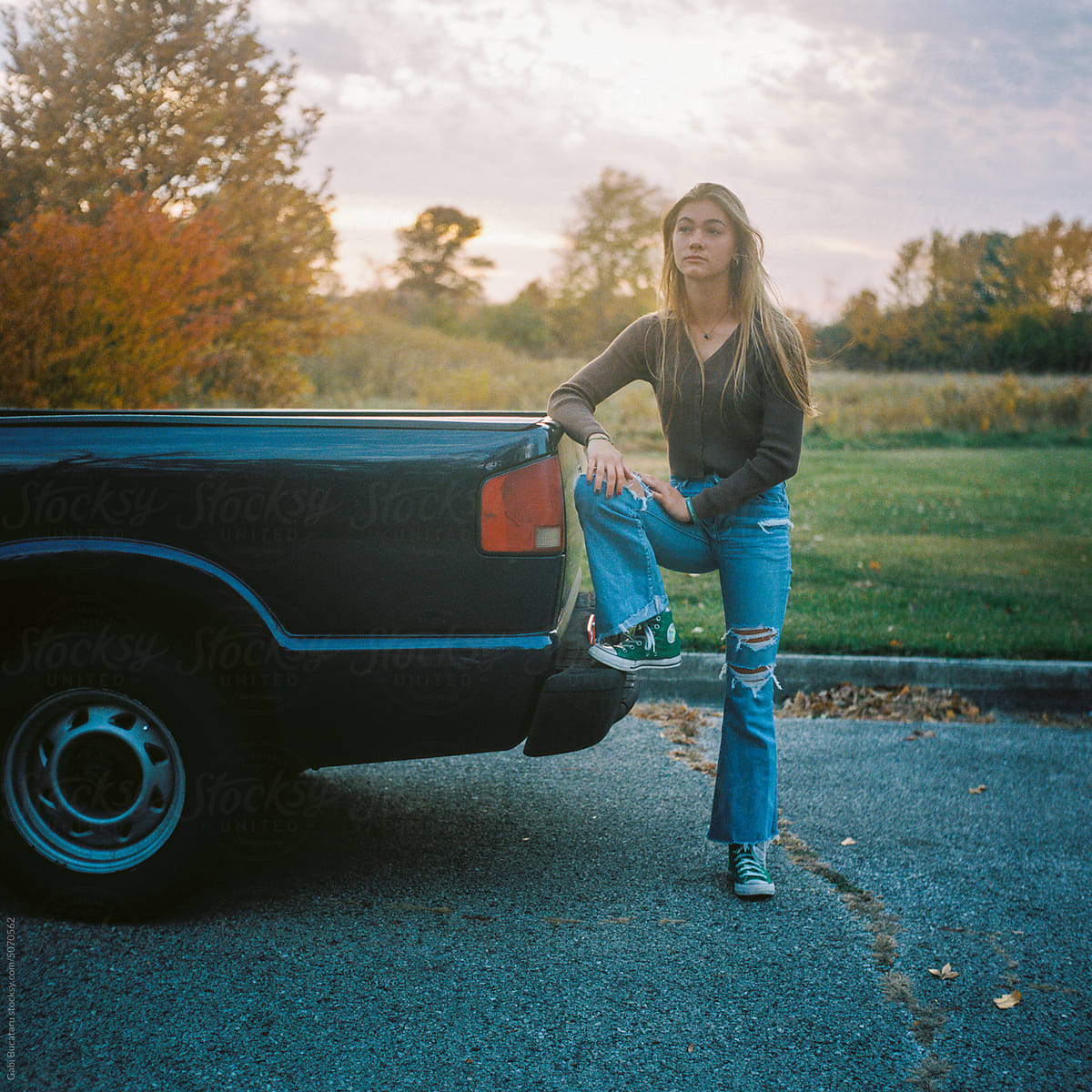 Teen girl by her truck