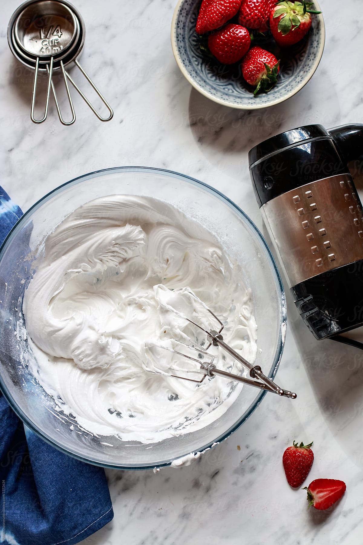 Raw meringue and hand mixer