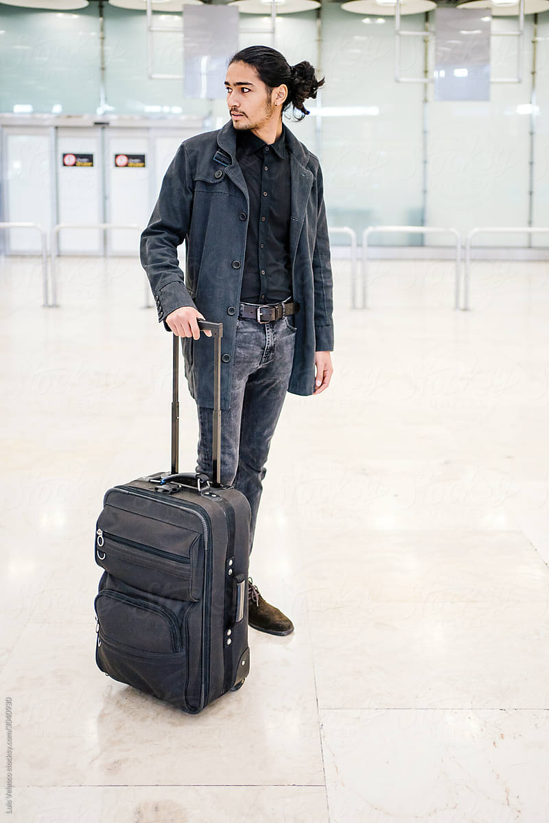 Elegant Young Man With Luggage In The Airport.