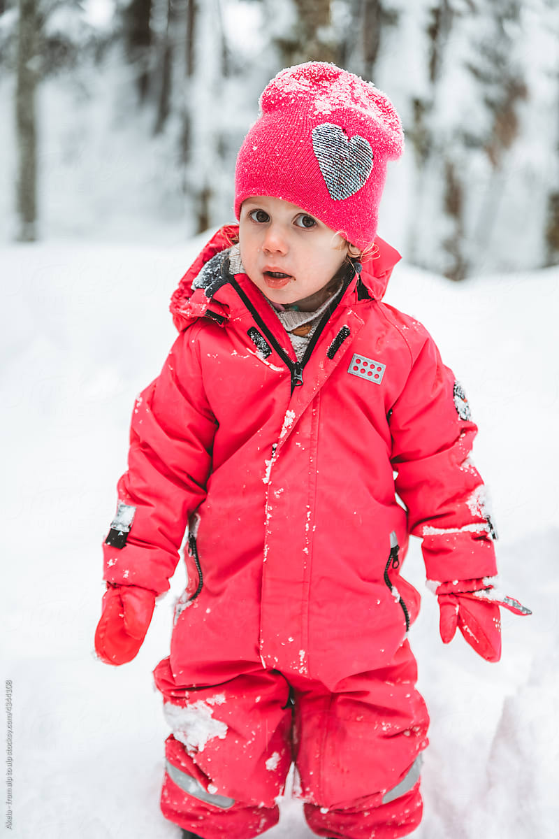 portrait of a girl in pink winter outfit