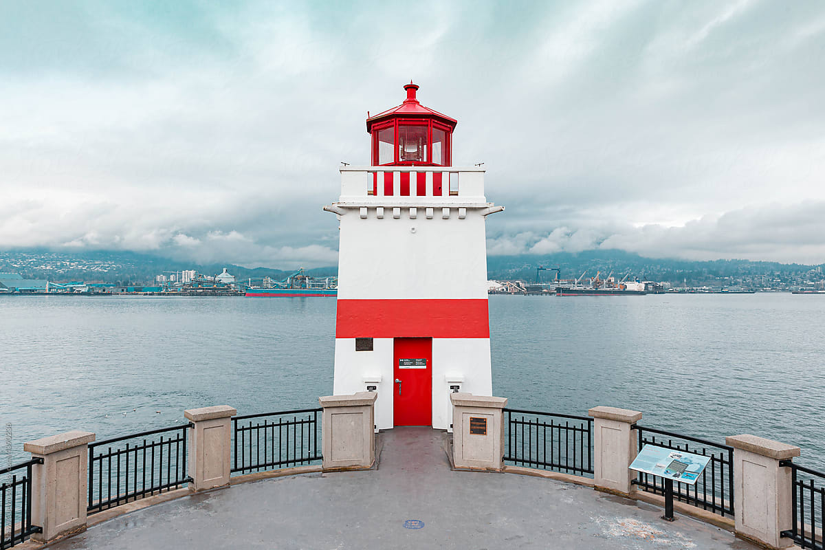 Lighthouse with red lines facing the sea