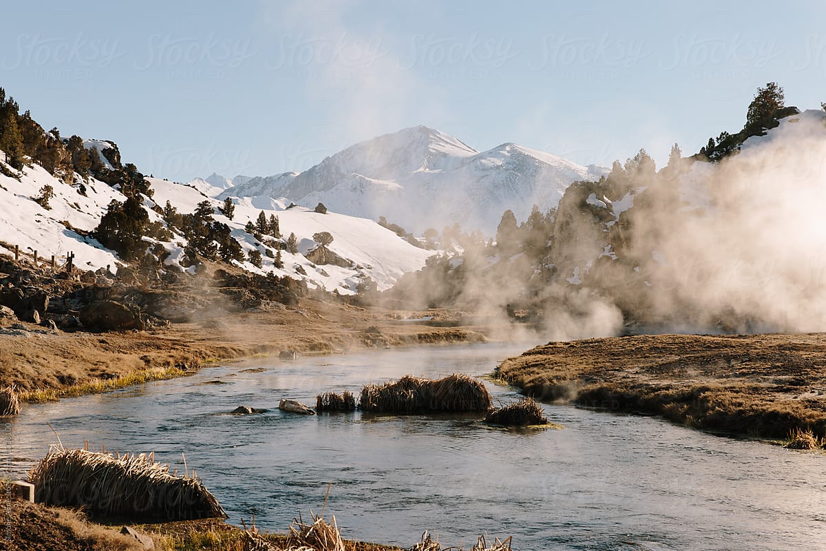 Creek with steam from hot springs flowing through the mountains