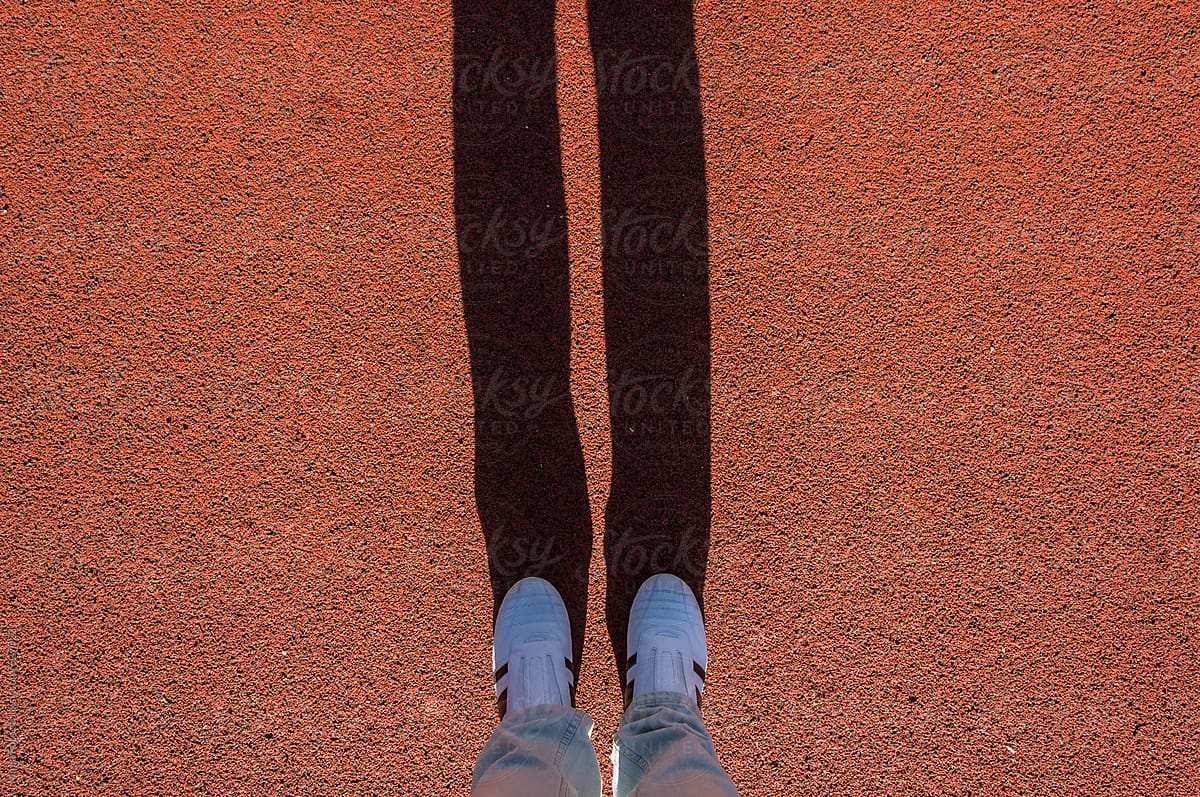 White sneakers, long shadow, footsie, personal perspective