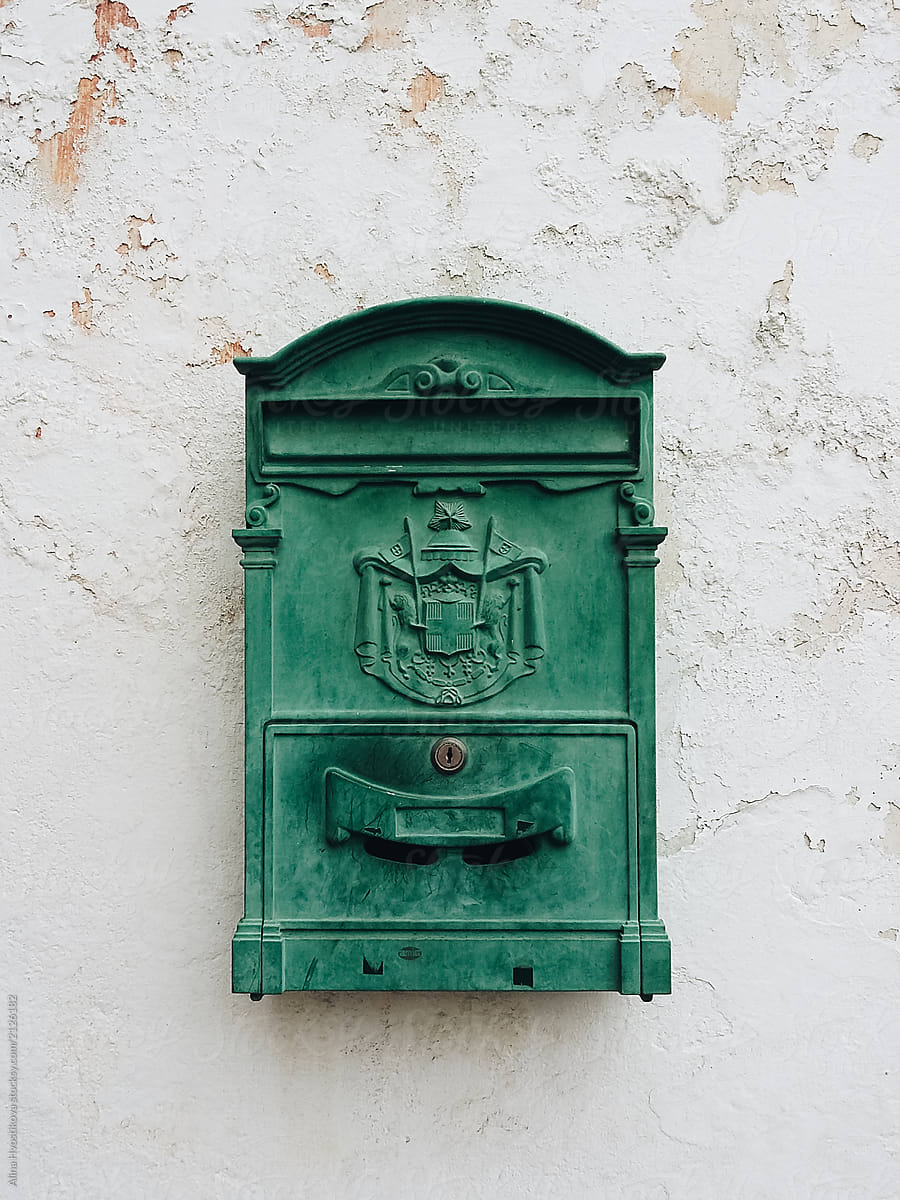 Vintage green mailbox with emblem