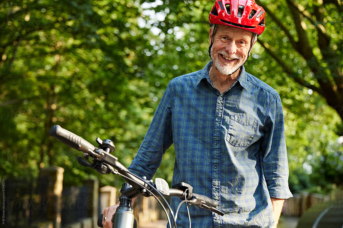 Older Man happily with Mountain bike