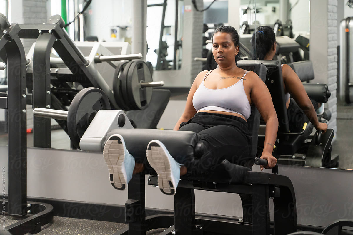 Plus Size Woman Working Out In The Gym