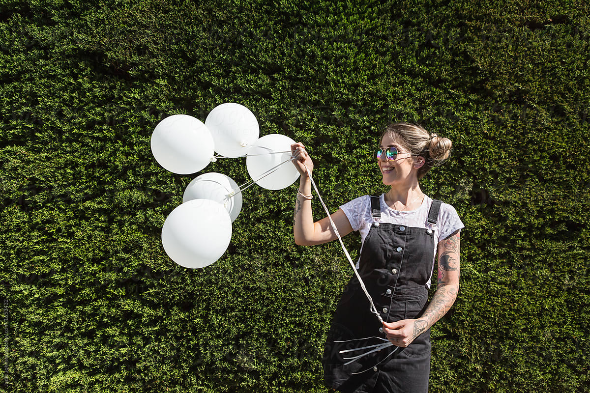 Girl with white balloons