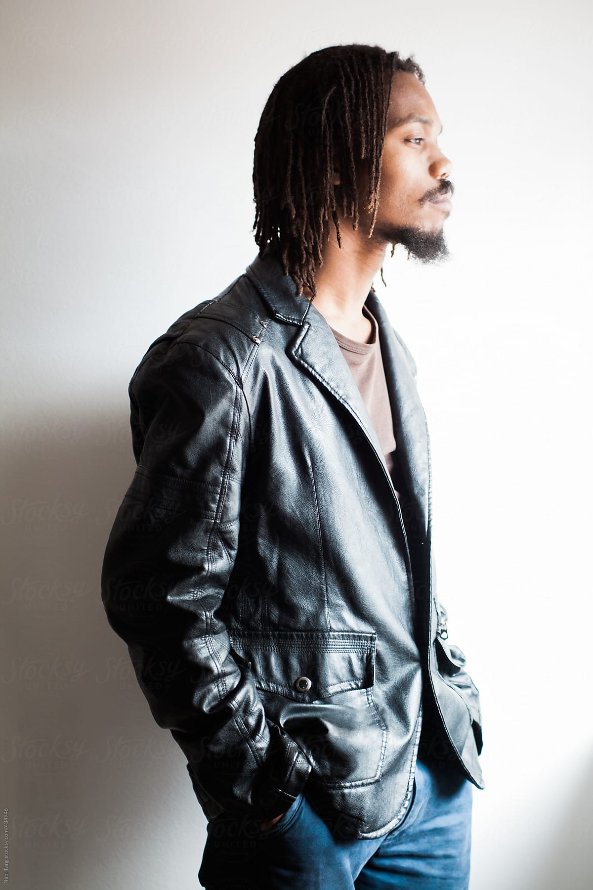 Handsome African guy portrait in black leather jacket