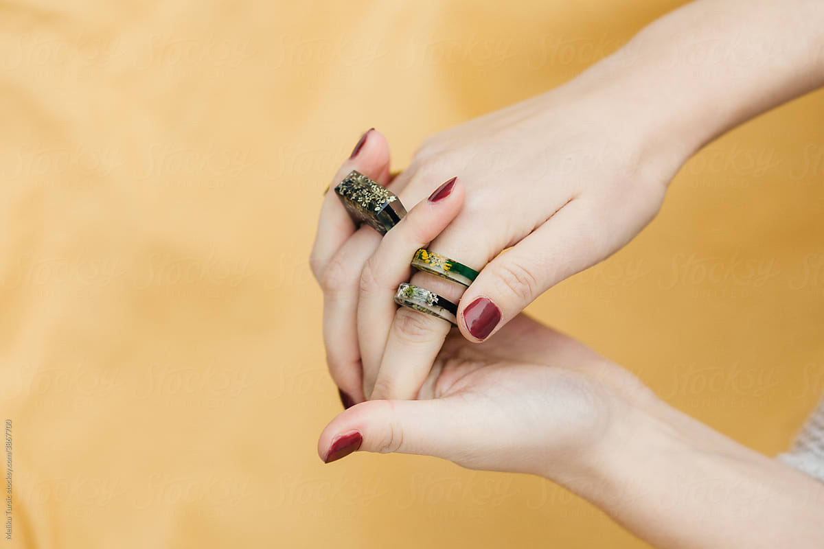 Studio shoot of female hands wearing handmade rings