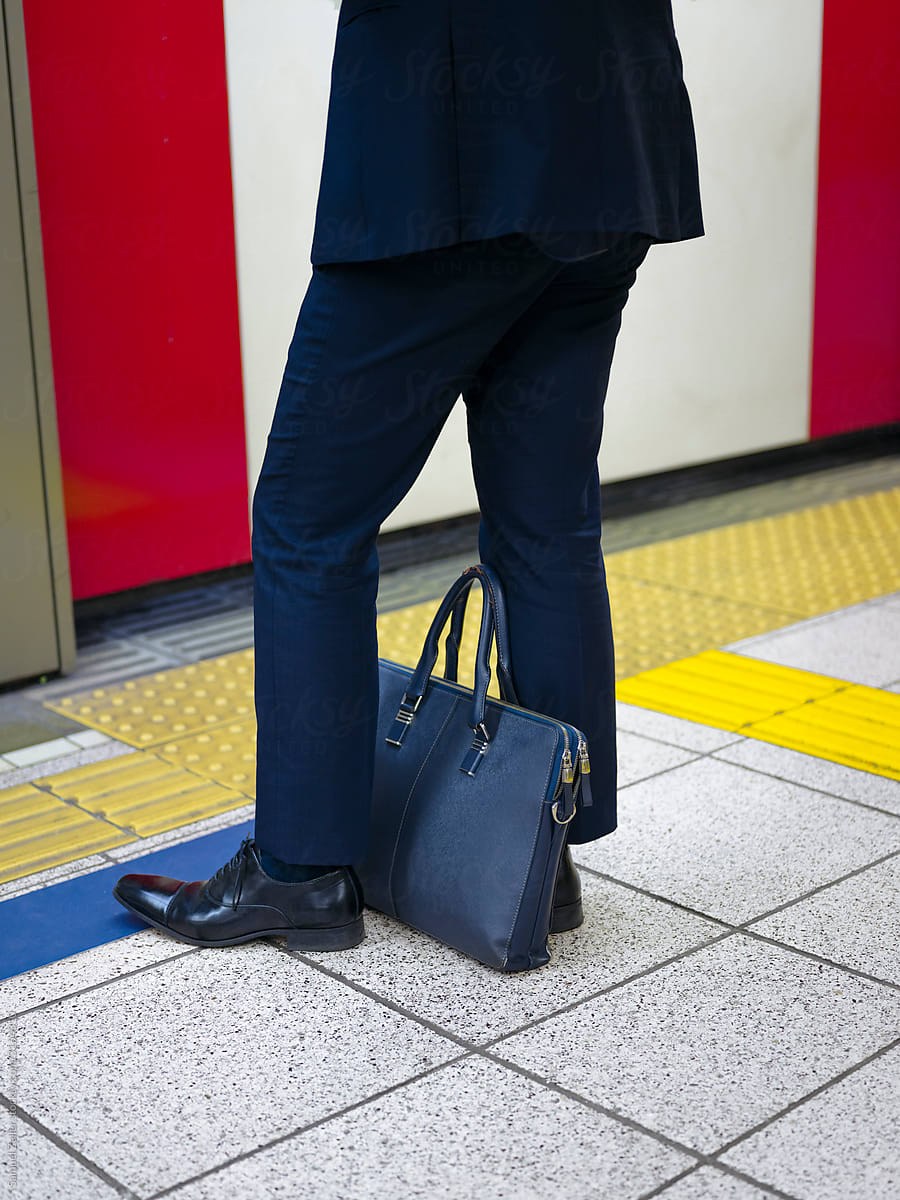 Businessman waiting for the metro in Tokyo