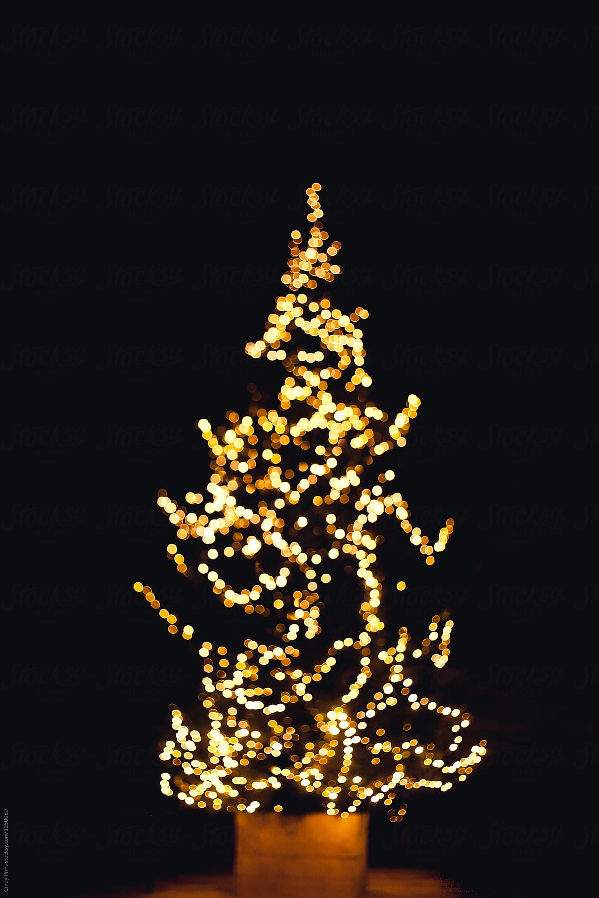A christmas tree with lights blurred on purpose